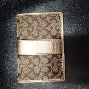 Coach bifold wallet soft leather interior.